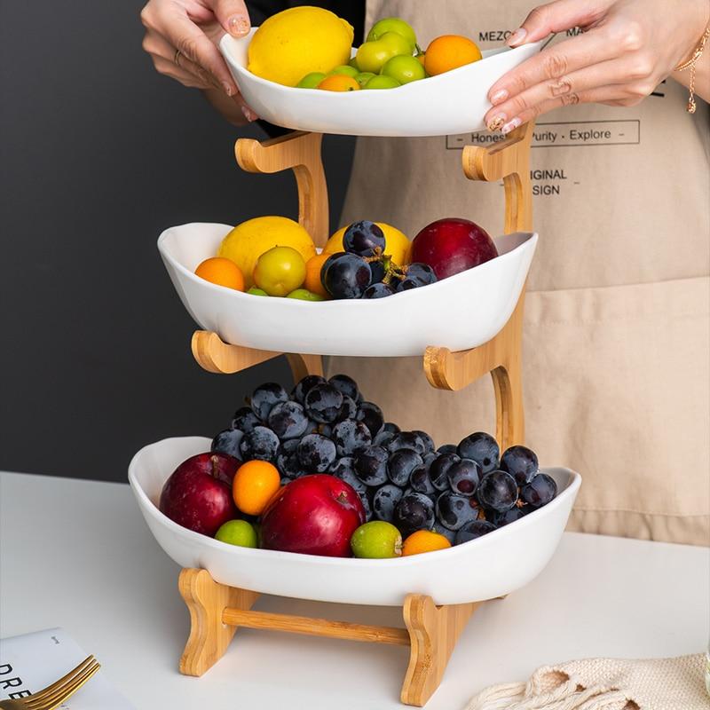 https://stillserenity.com/cdn/shop/products/Living-Room-Home-Three-layer-Plastic-Fruit-Plate-Snack-Plate-Creative-Modern-Dried-Fruit-Fruit-Basket_5f48553a-0673-42f8-bc3a-ab316cdbb1b7_800x.jpg?v=1621941805